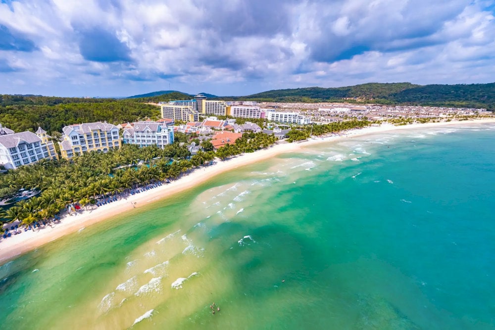 Khem Beach boasts rare, untouched tranquility with crystal-clear water and soft white sand, making it a perfect spot to unwind in nature